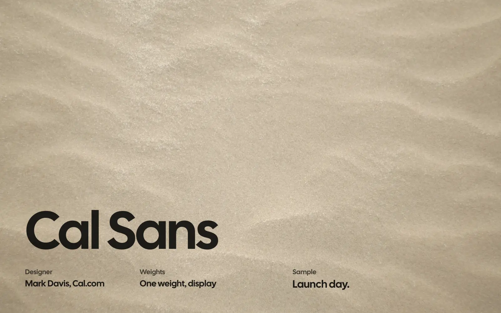Cal Sans specimen in black on a sand texture: designer Mark Davis for Cal.com, one display weight