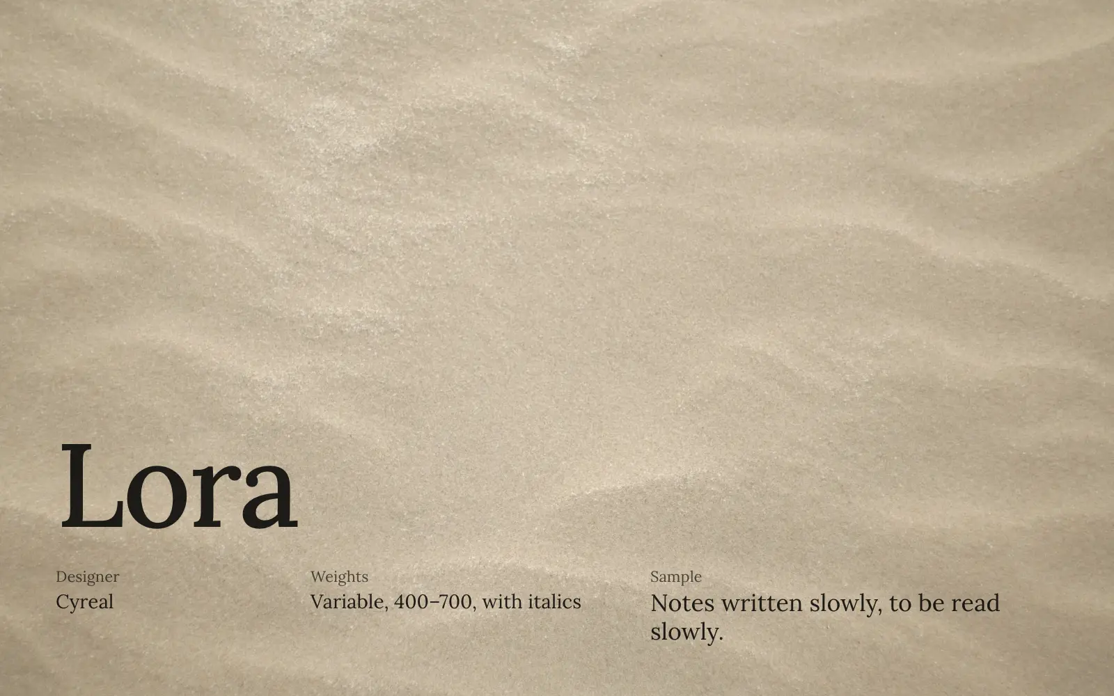 Lora specimen in black on a sand texture: designer Cyreal, variable from 400 to 700 with italics