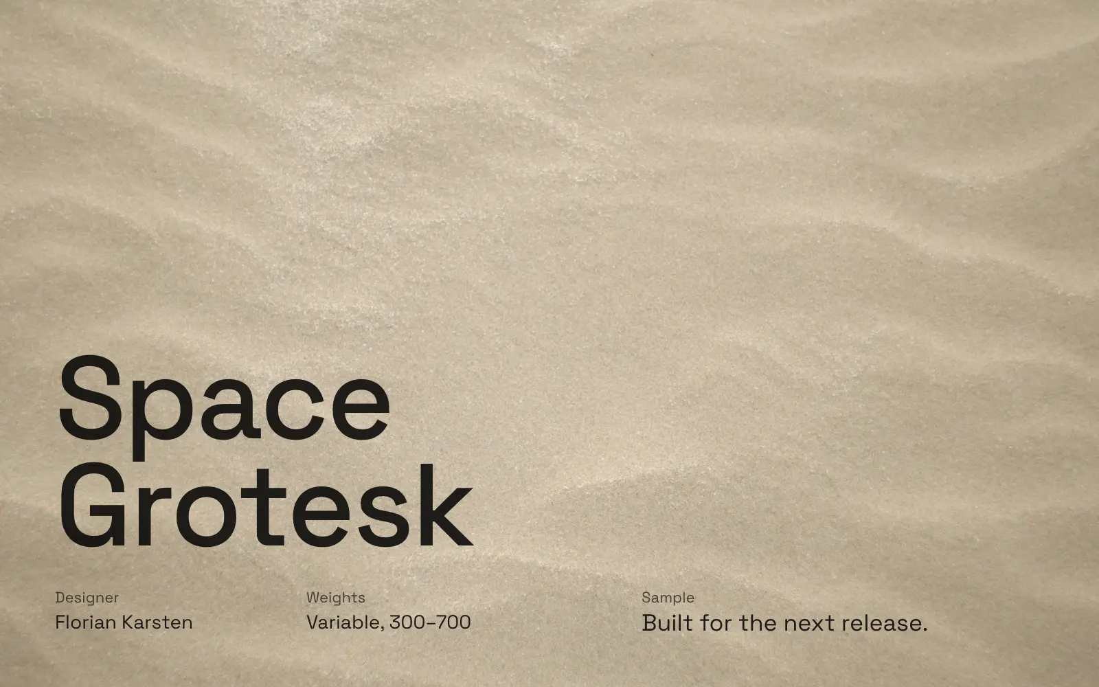 Space Grotesk specimen in black on a sand texture: designer Florian Karsten, variable from 300 to 700